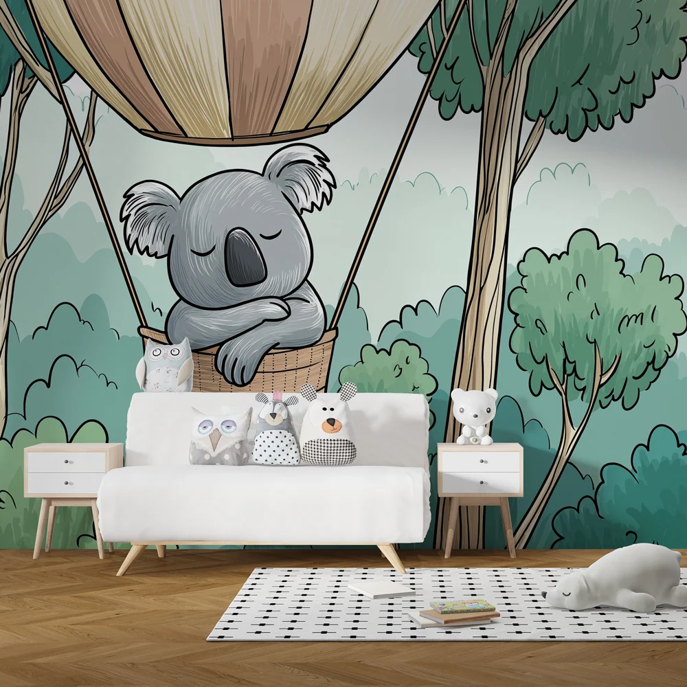 Gyermekszoba tapéta | Koala egy kosárban az erdő felett